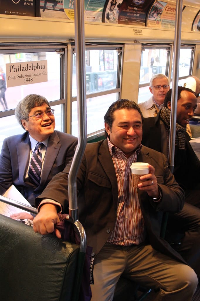 Robert Iopa, president and principal of WCIT Architecture in Honolulu (center); and George Atta, director of Honolulu's Department of Planning and Permitting (left) on board a Muni historic streetcar.