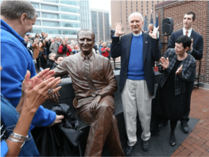 Indianapolis Mayor Greg Ballard unveils a statue of former Mayor Bill Hudnut with Hudnut and family looking on. 