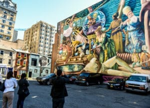 The city of Philadelphia's Mural Arts Program invites artists to engage with local residents on public art projects. 