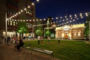 The 1904 Administration Building is nestled among new mixed-use construction creating a charming public space. Credit: Scott Martin
