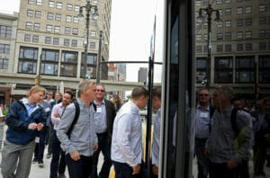 Attendees board the Qline light rail during the Midtown mobile walking tour at the ULI Small Scale Developer Forum in Detroit, Mich., on Monday, June 5, 2017.